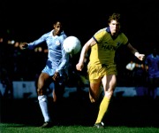 Mike Lyons and Dave Bennett do battle at Maine Road